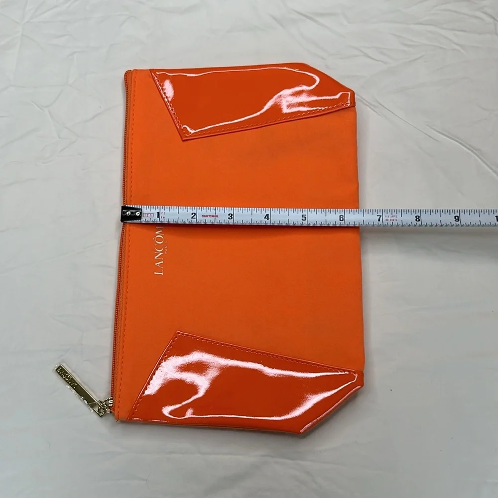 BEAND NEW! Vibrant Orange Cosmetic Bag with Glossy Finish and Zipper Closure.
